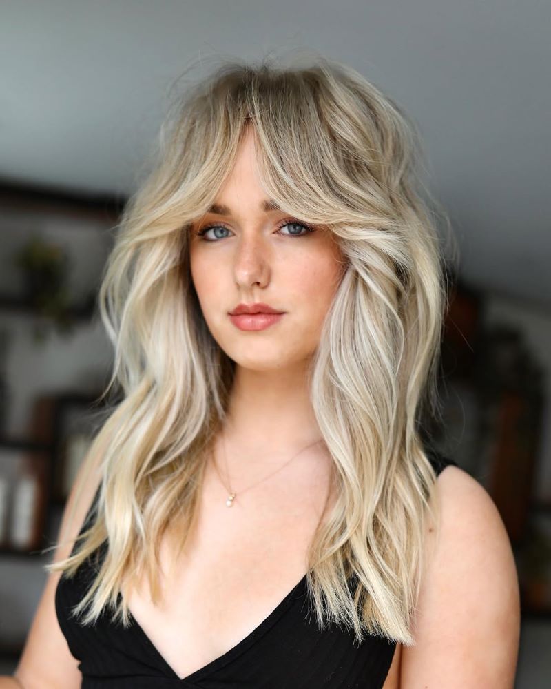 Curtain Bangs with Subtle Highlights